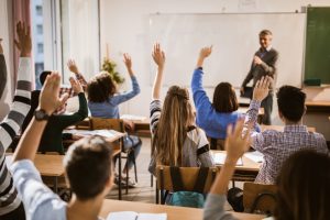 Students raising hands