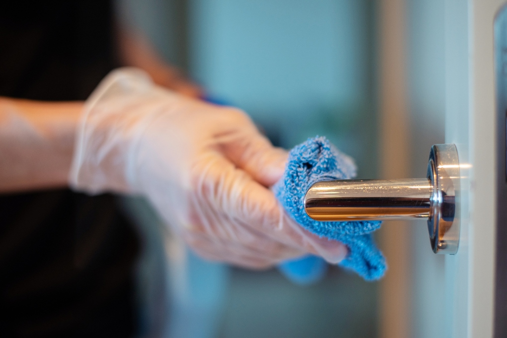 Cleaning and disinfecting the door knob